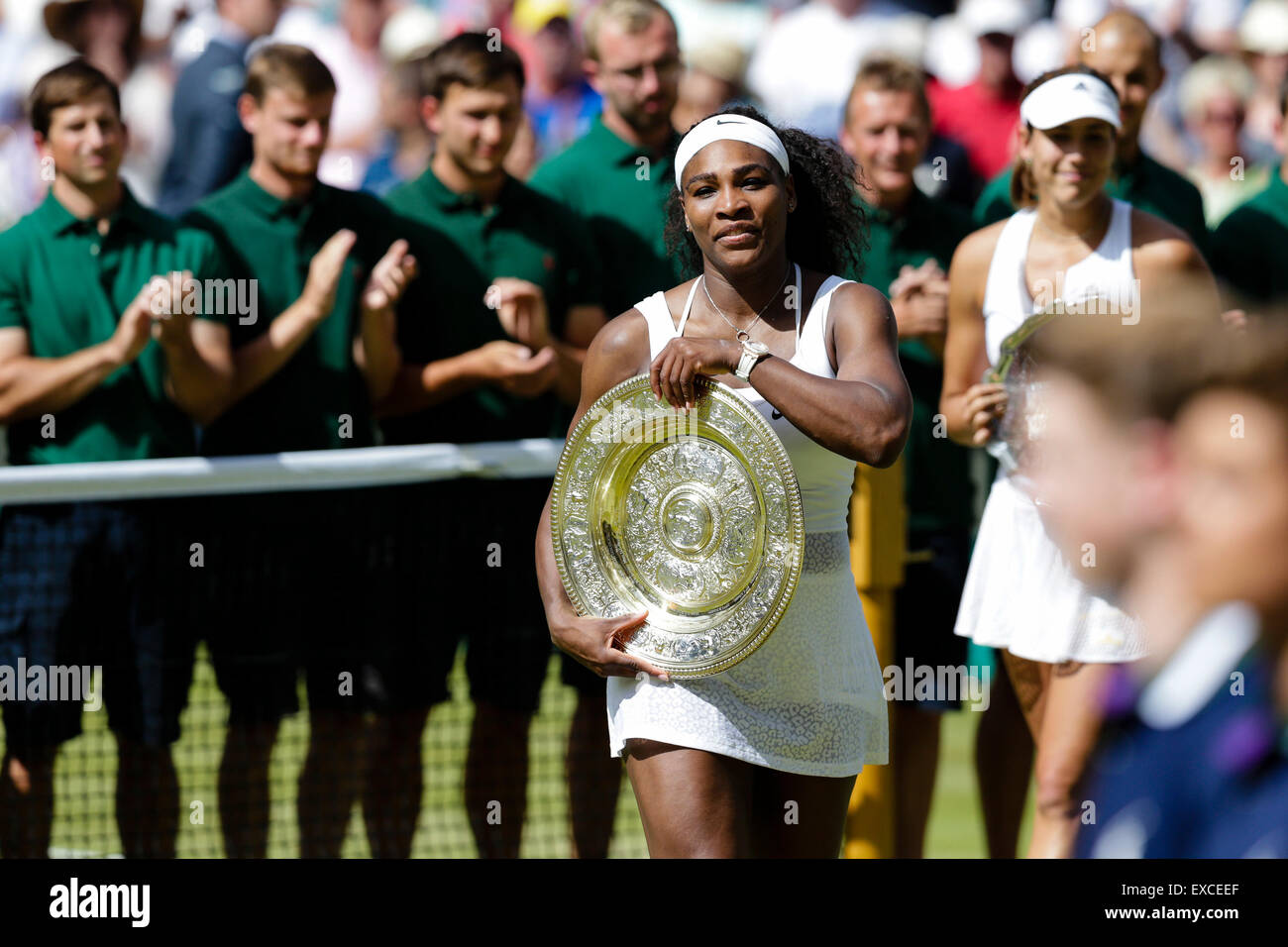 Wimbledon, UK. 11th July, 2015. The Wimbledon Tennis Championships. Ladies Singles Final between top seed Serena Williams (USA) and twentieth seed Garbine Muguruza (ESP). Serena Williams applauded off centre court with the winners trophy Credit:  Action Plus Sports/Alamy Live News Stock Photo