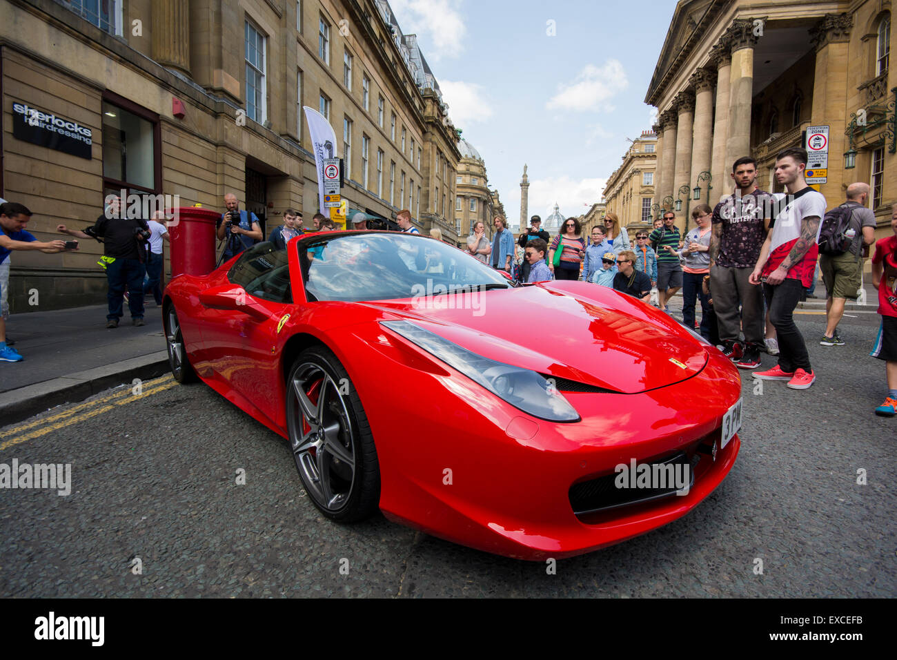 Grey Street, Newcastle, UK. 11th July, 2015. NE1 Cars and crowds at the Newcastle Motor Show Saturday July 11 2015. Credit:  Peter Reed / Alamy Live News Stock Photo