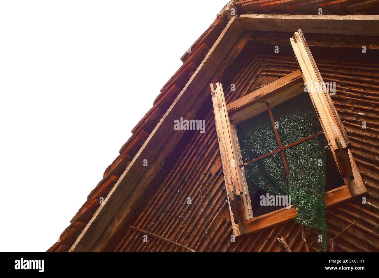 Part of an old wooden house, with empty white space on the left. Stock Photo