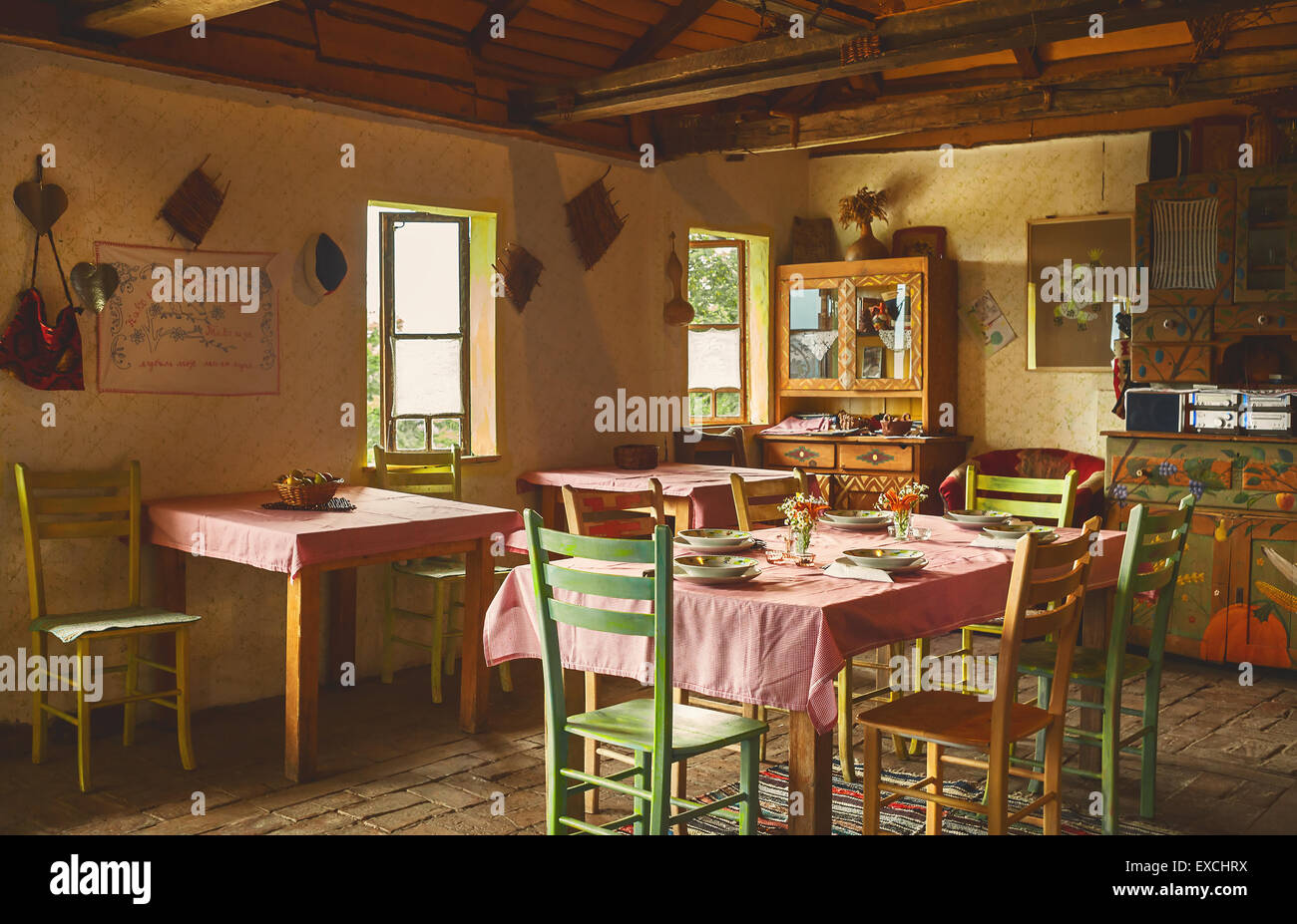 Interior design of an old Serbian restaurant, decoration and prepared table for lunch. Stock Photo