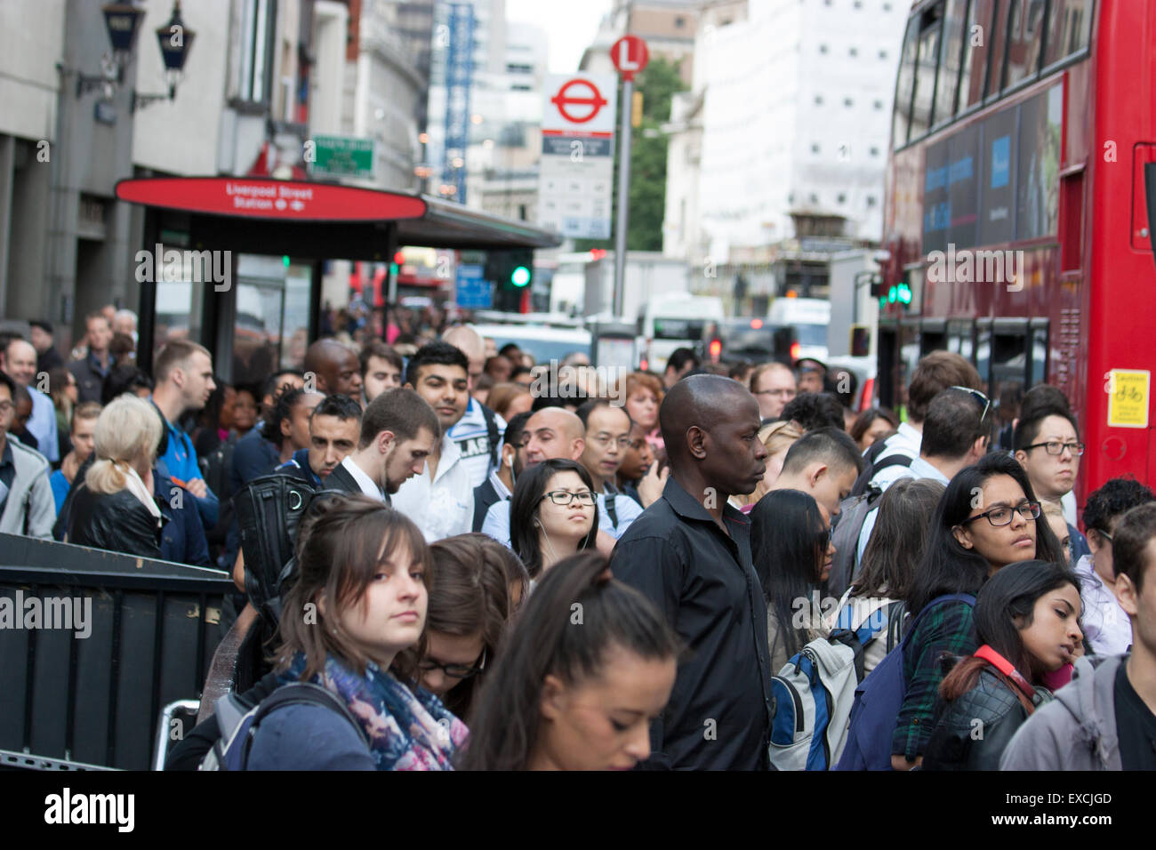 Queues for buses during Londons underground rail tube strike at bus stop at Liverpool street Stock Photo