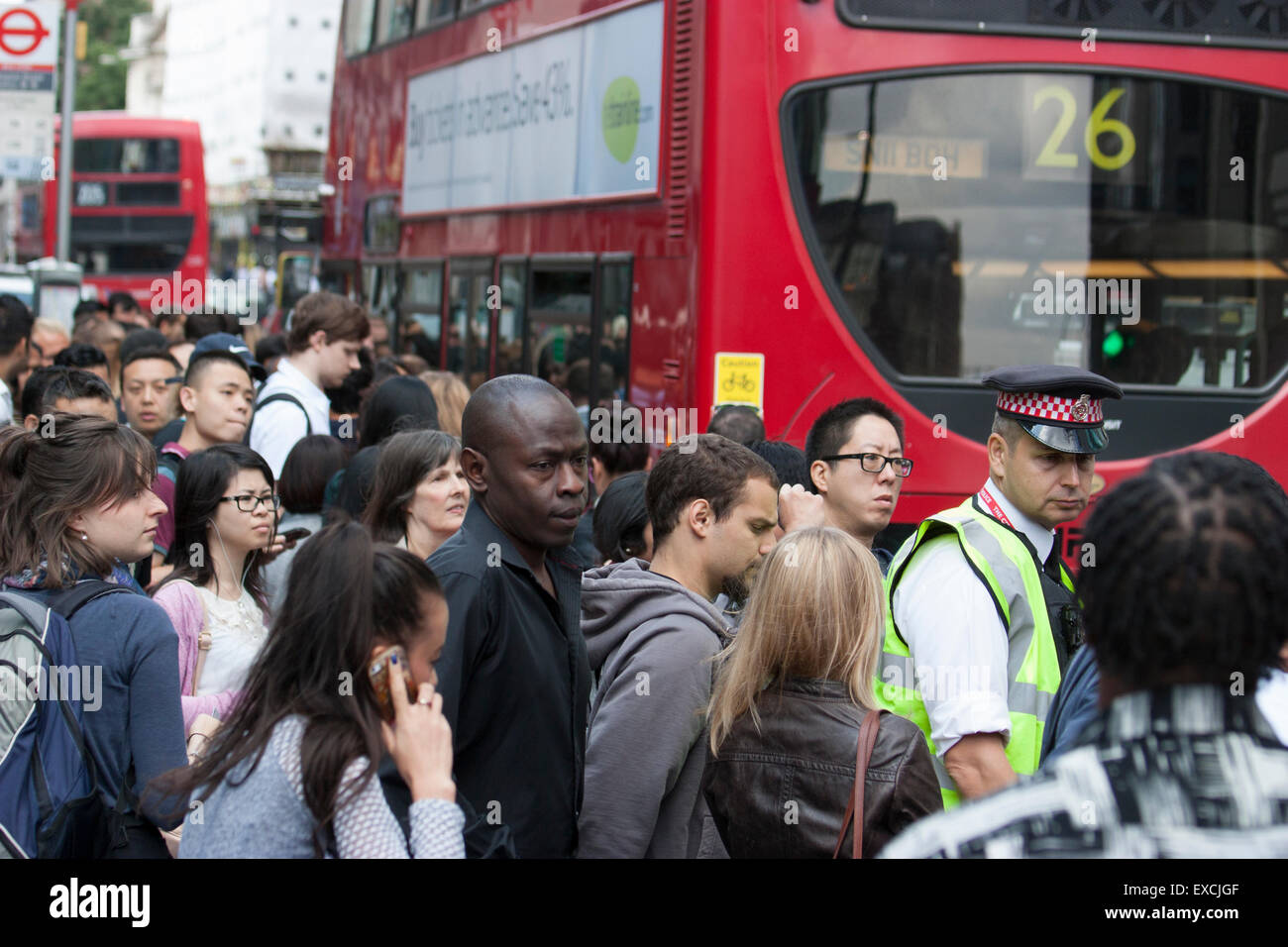 Police control Queues for buses during Londons underground rail tube