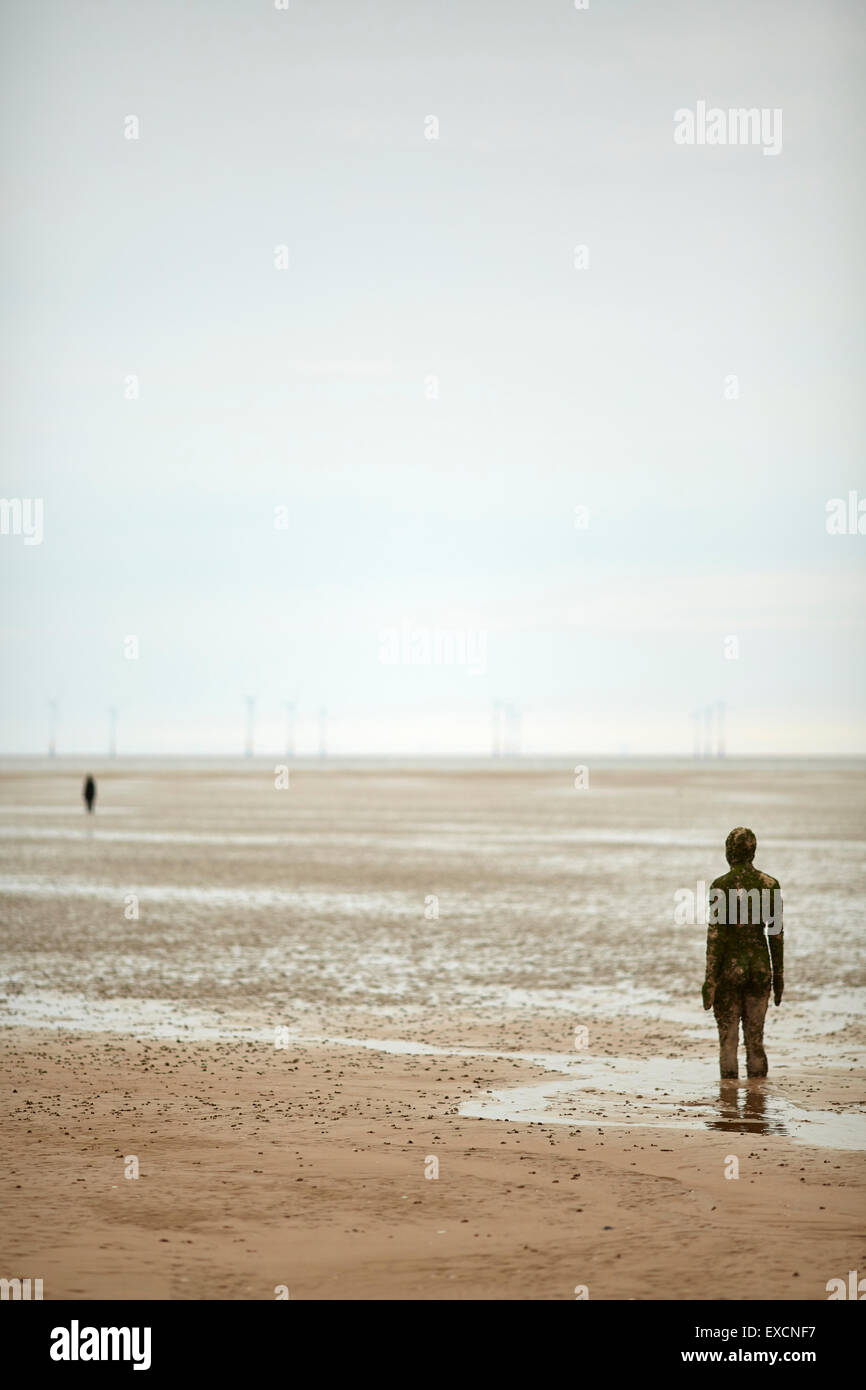 Pictures around Southport   Another Place is a piece of modern sculpture by Antony Gormley. It consists of 100 cast iron sculptu Stock Photo