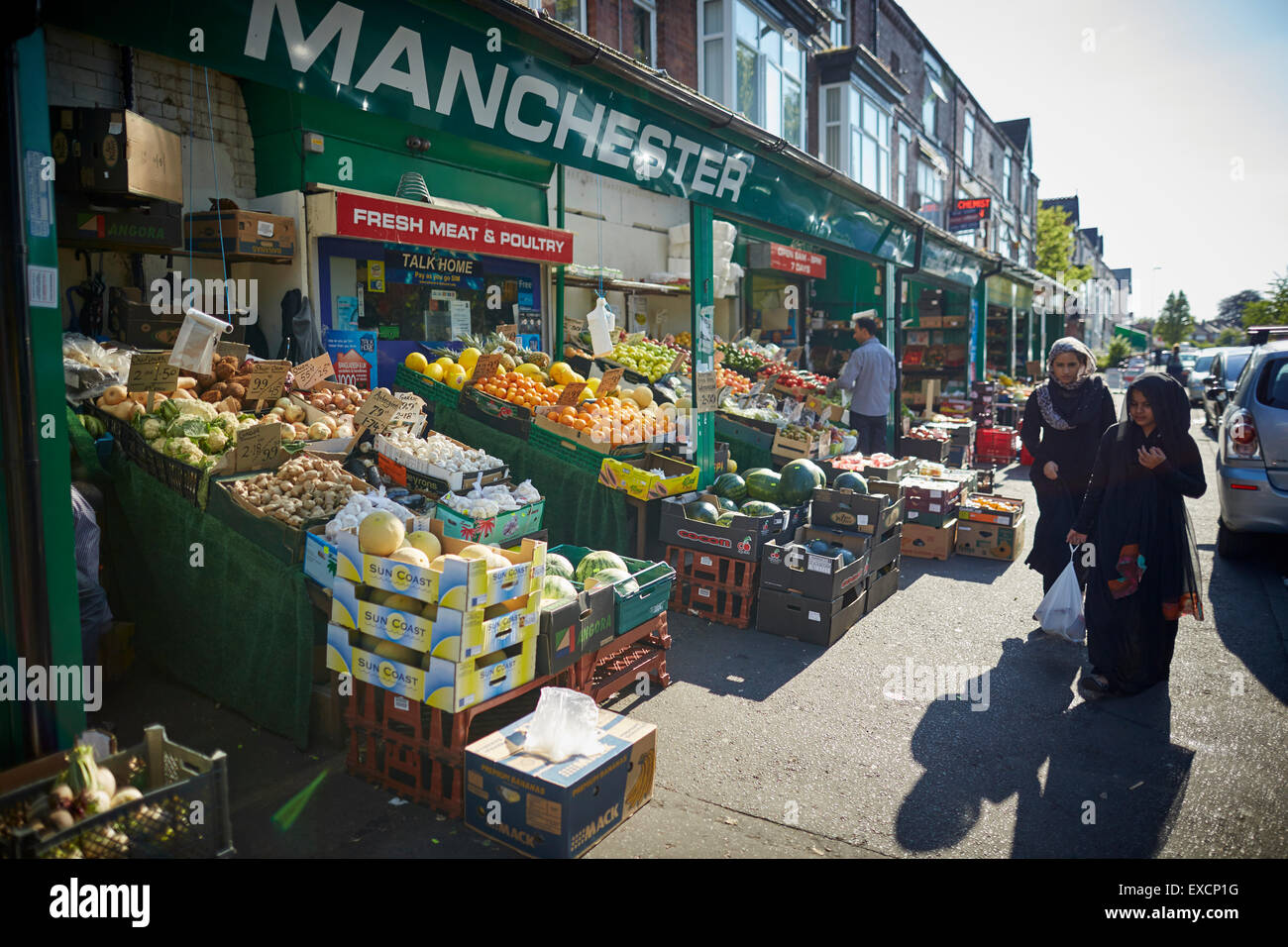 MANCHESTER Whalley Range area shops on Clarendon Rd Fruit supermarket asian  world foods street traders indian pakistan communi Stock Photo - Alamy