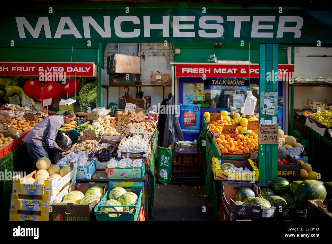 MANCHESTER Whalley Range area shops on Clarendon Rd Fruit supermarket asian  world foods street traders indian pakistan communi Stock Photo - Alamy