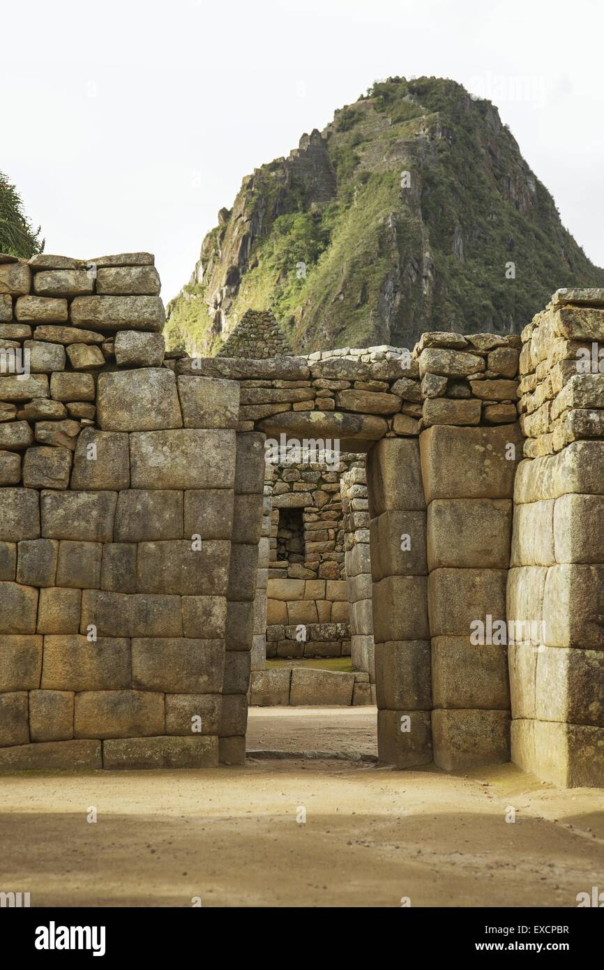 Wayna Picchu behind ruins of doors inside Machu Picchu, Peru Stock Photo