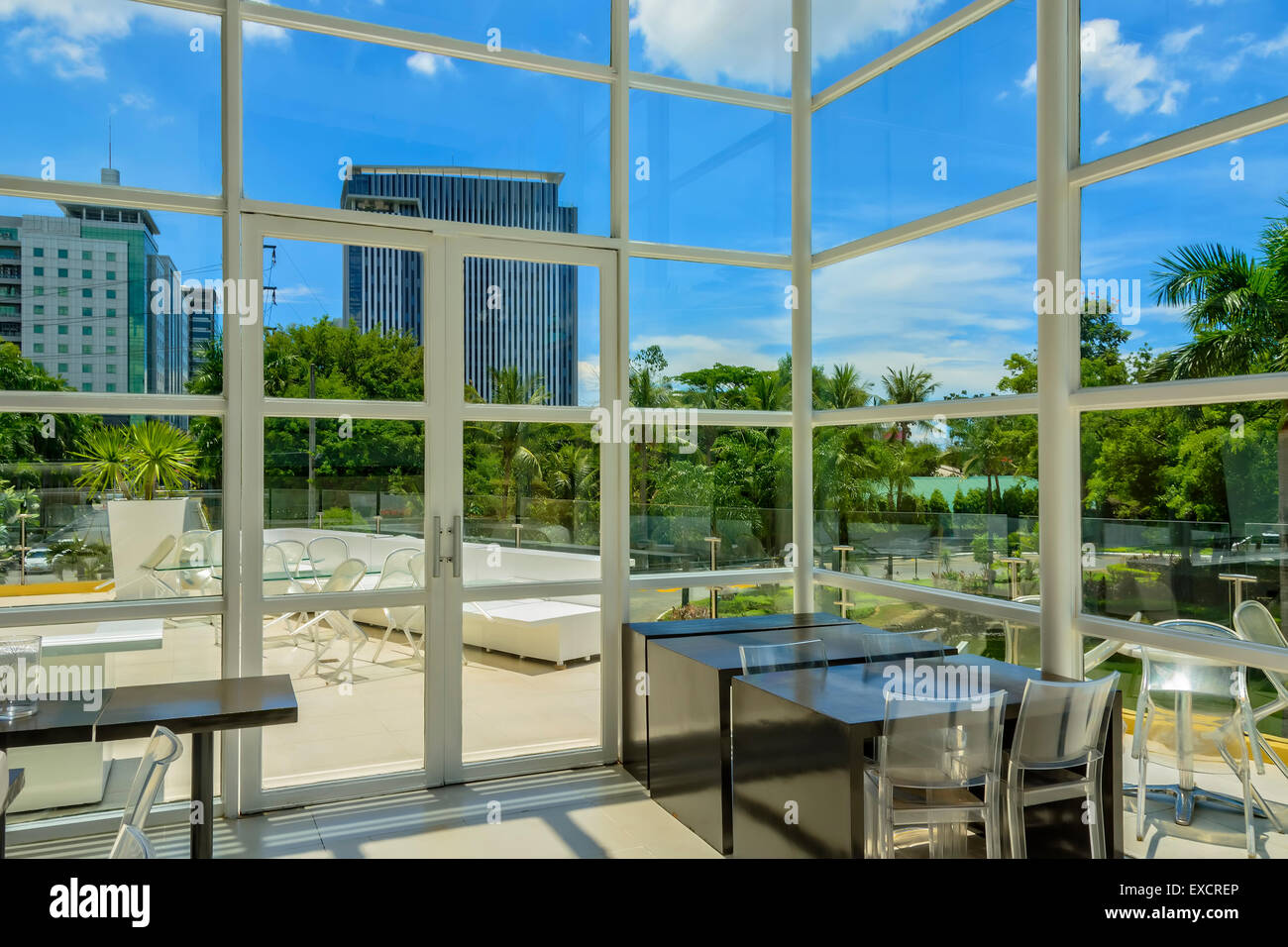 A beautiful wall to ceiling glass bar in a Philippine city Stock Photo