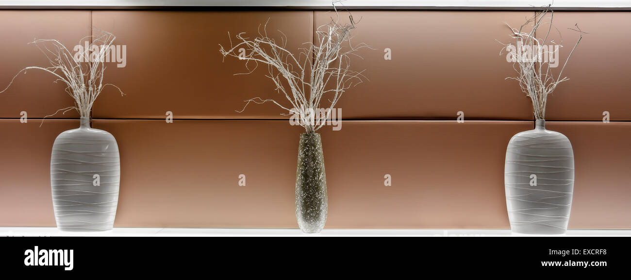 Architectural Vase Decoration With Painted Twigs On Wall Stock