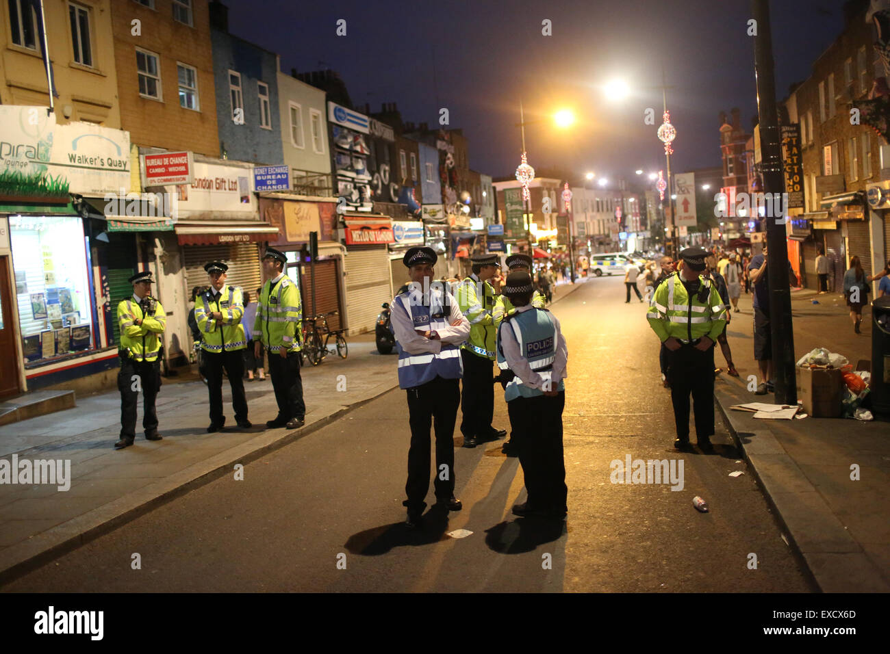 London, UK. 11th July, 2015. Police, including Liasion officers oversee an anti-fascist demonstration over gentrification in Camden Town. The march turned violent after anti-fascist protesters encountered attendees of an alleged 'white pride' gig Credit:  Finn Nocher/Alamy Live News Stock Photo