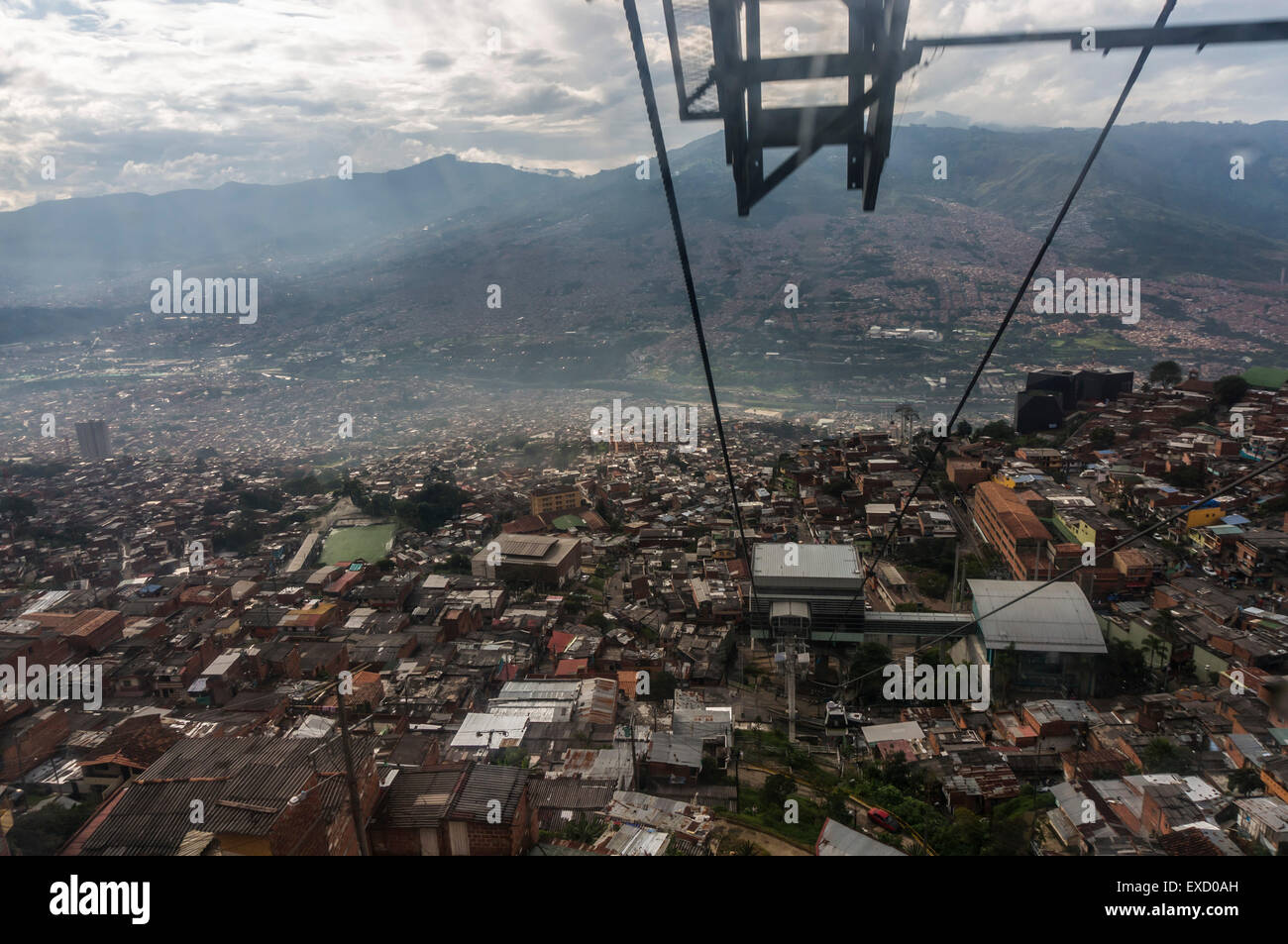 A view of the lower income neighborhoods  on the slopes above Medellin, Colombia from the Teleférico or air tram station. Stock Photo