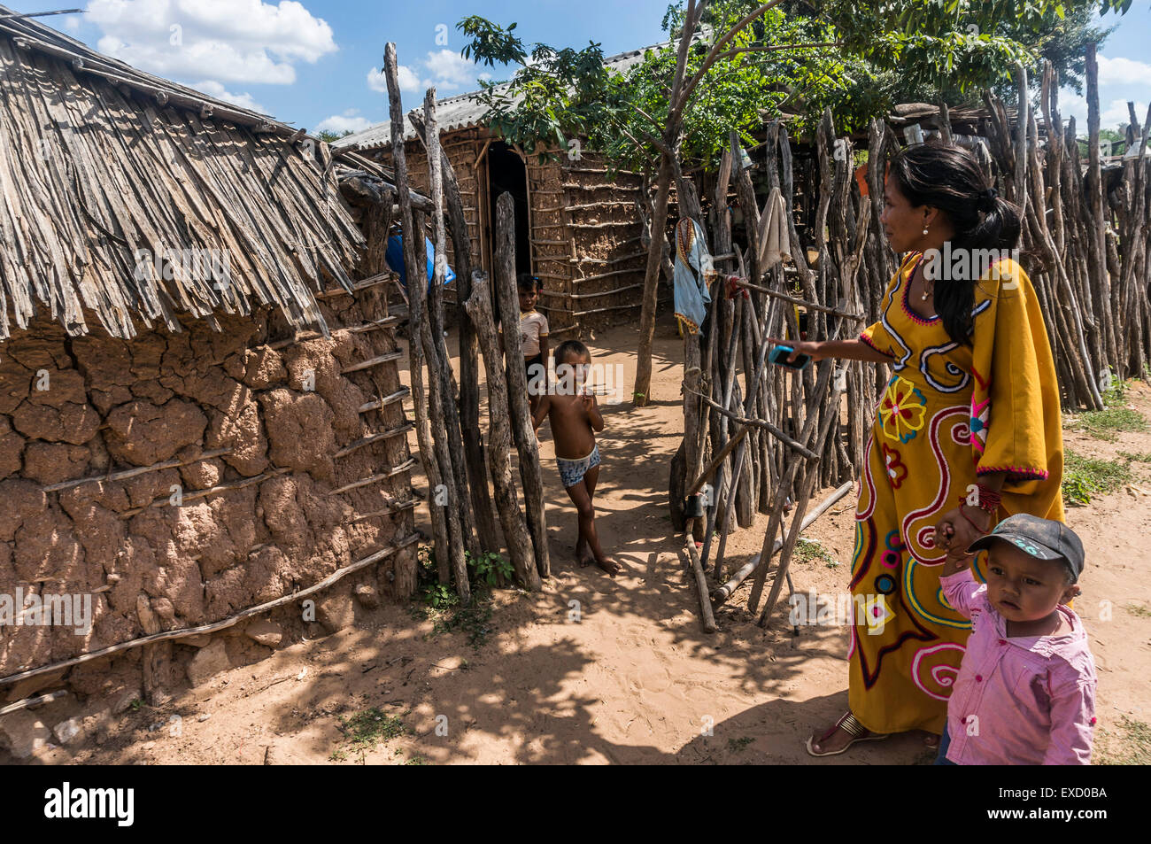 Outside a Wayuu indigenous family home in a 'rancheria', or traditional rural settlement, in La Guajira, Colombia. Stock Photo