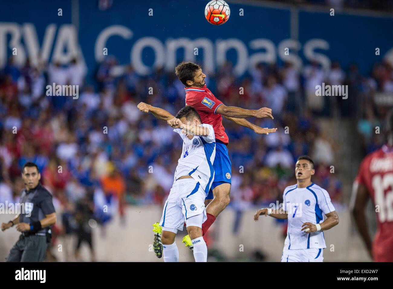 July 11, 2015: Costa Rica midfielder Celso Borges (5) and El Salvador midfielder Richard Menjivar (6) battle for a header during the 1st half of an international CONCACAF Gold Cup soccer match between Costa Rica and El Salvador at BBVA Compass Stadium in Houston, TX. The game ended in a 1-1 draw. Credit:  Cal Sport Media/Alamy Live News Stock Photo