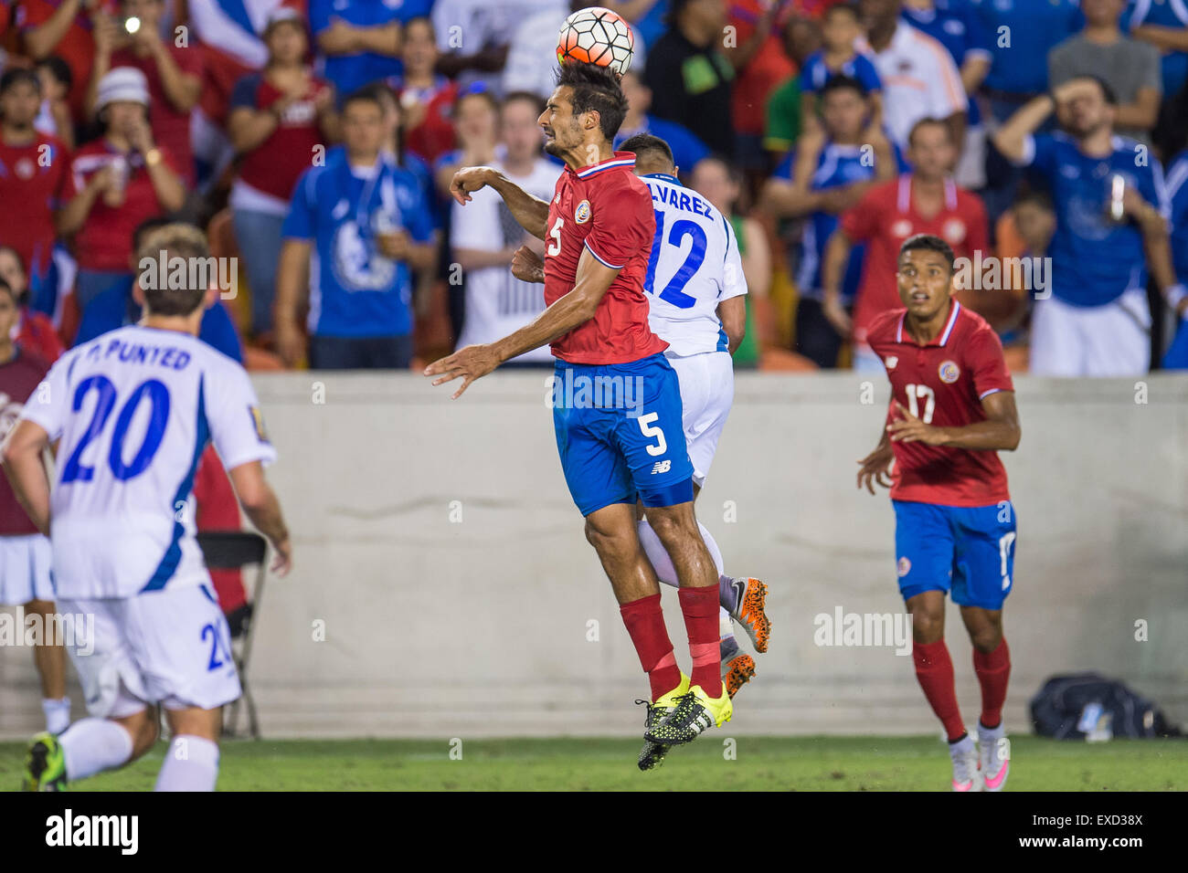July 11, 2015: Costa Rica midfielder Celso Borges (5) and El Salvador midfielder Arturo Alvarez (12) battle for a header during the 2nd half of an international CONCACAF Gold Cup soccer match between Costa Rica and El Salvador at BBVA Compass Stadium in Houston, TX. The game ended in a 1-1 draw. Credit:  Cal Sport Media/Alamy Live News Stock Photo