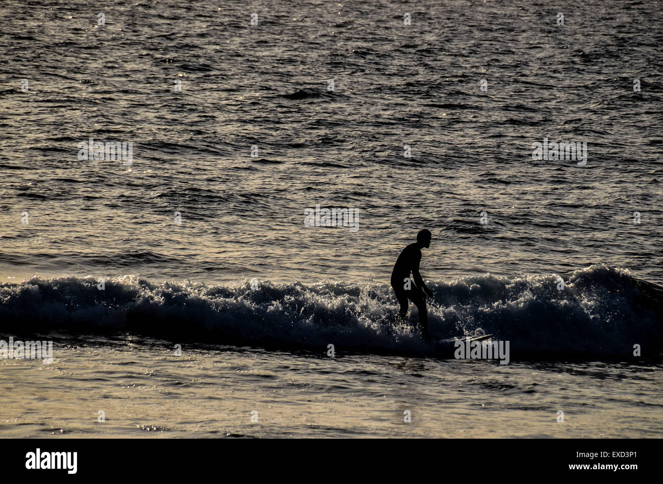 Silhouette Surfer at Sunset Stock Photo - Alamy