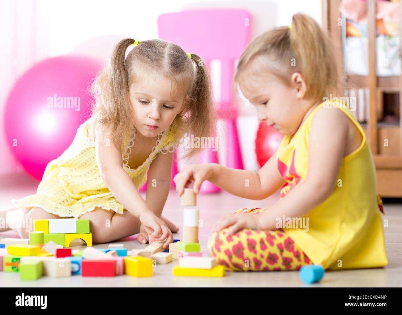 children playing wooden toys at home Stock Photo - Alamy