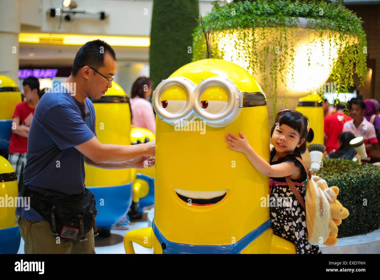 Father and daughter posing for photo with Kevin, characters of the ...