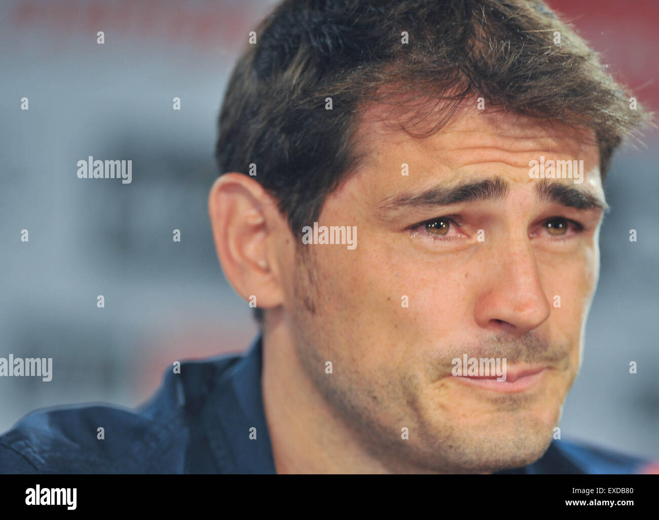 Madrid, Spain. 12th July, 2015. Real Madrid's goalkeeper Iker Casillas sheds tears during the press conference at the Santiago Bernabeu stadium in Madrid, Spain, July 12, 2015. The 34-year-old Iker Casillas will leave the Spanish La Liga top club for FC Porto after 25 years. Credit:  Xie Haining/Xinhua/Alamy Live News Stock Photo