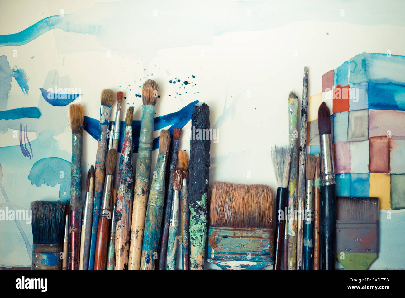 abstract brushes and paint in atelier Stock Photo