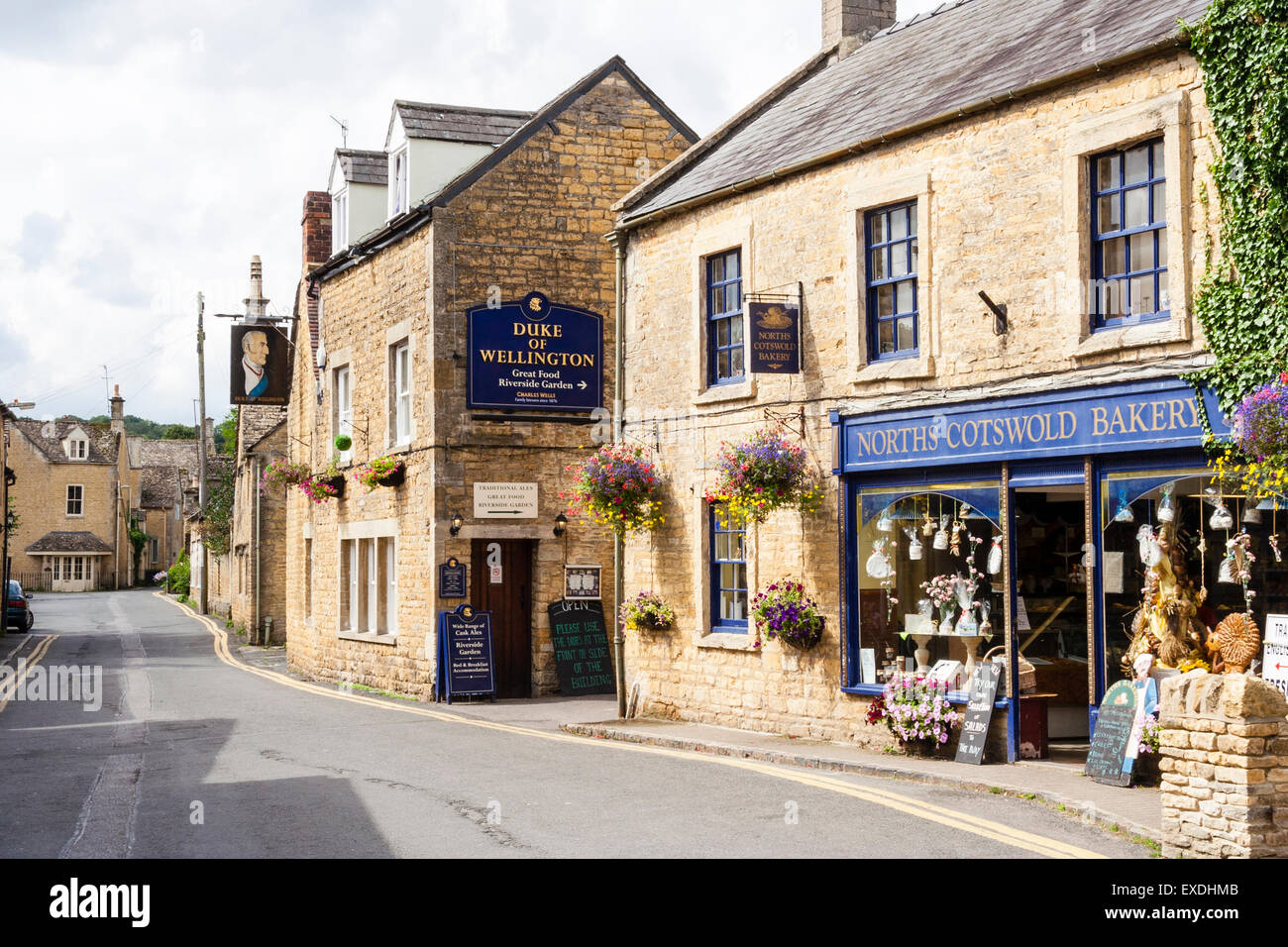English Cotswold market town, Bourtononthewater. View along street