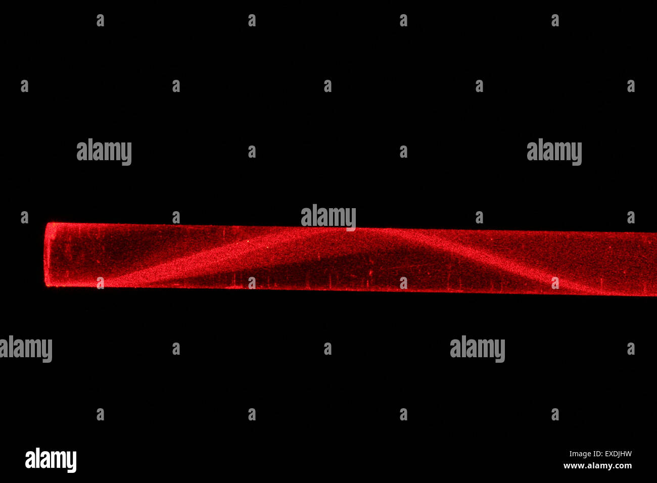 laserlight in glassfibre. Variable refractive index reduces loss of light. Stock Photo