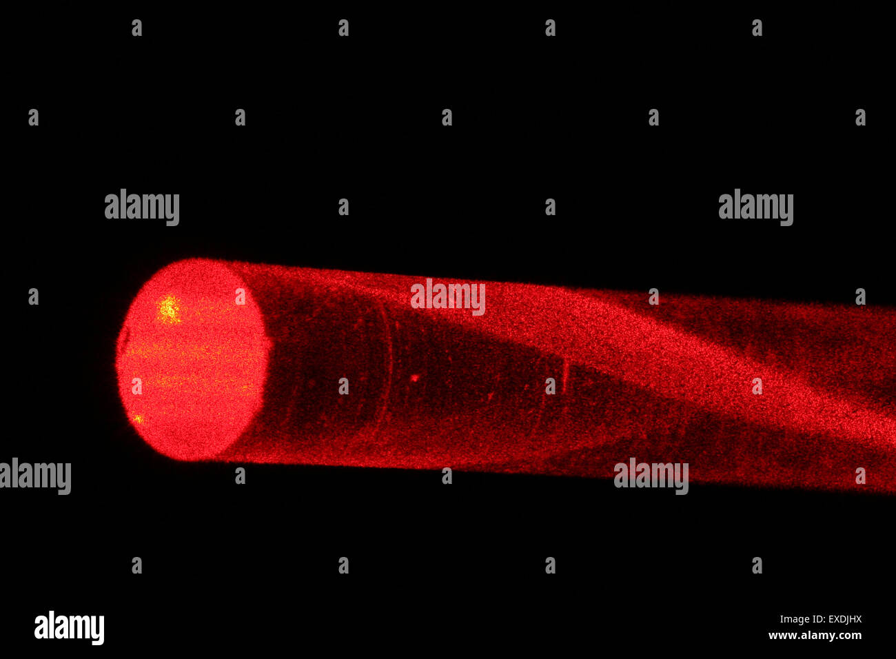 laserlight in glassfibre. Variable refractive index reduces loss of light. Stock Photo