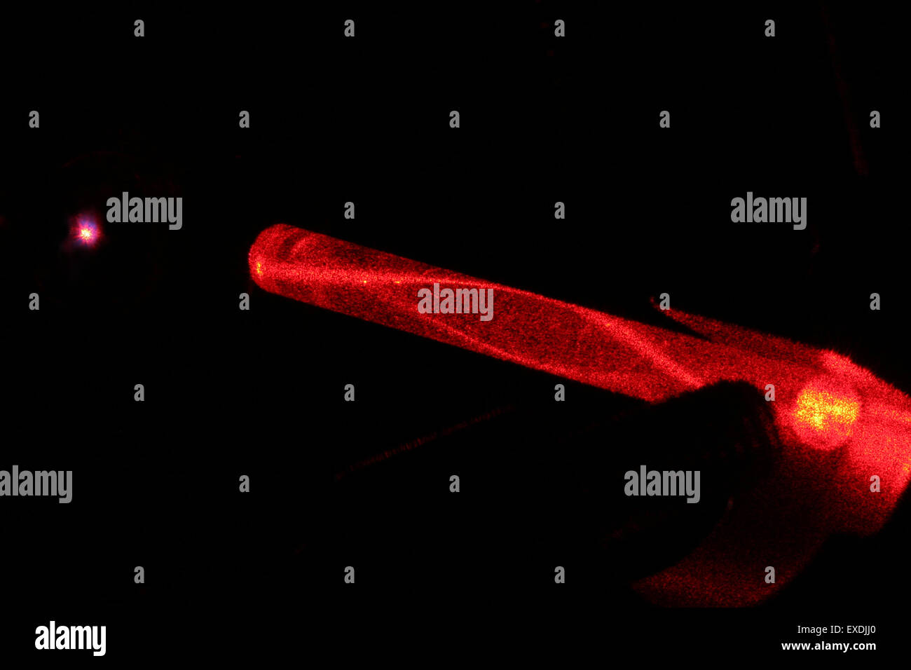 laserlight in glassfibre. Variable refractive index reduces loss of light. Stock Photo