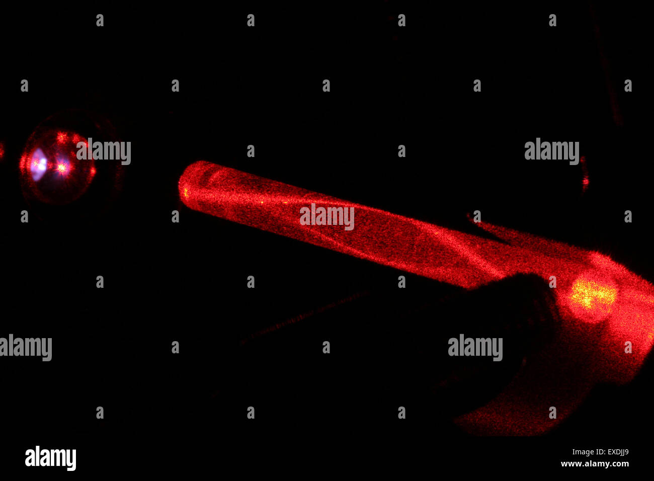 laserlight in glassfibre. Variable refractive index reduces loss of light. Stock Photo