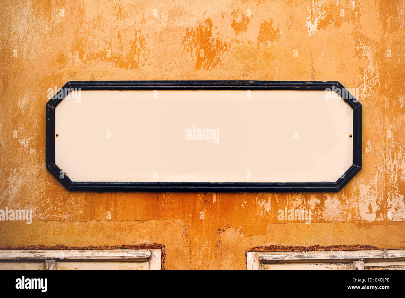 Blank Vintage Advertising Board as Copy Space on Old Wall, Retro Tone Effect Stock Photo