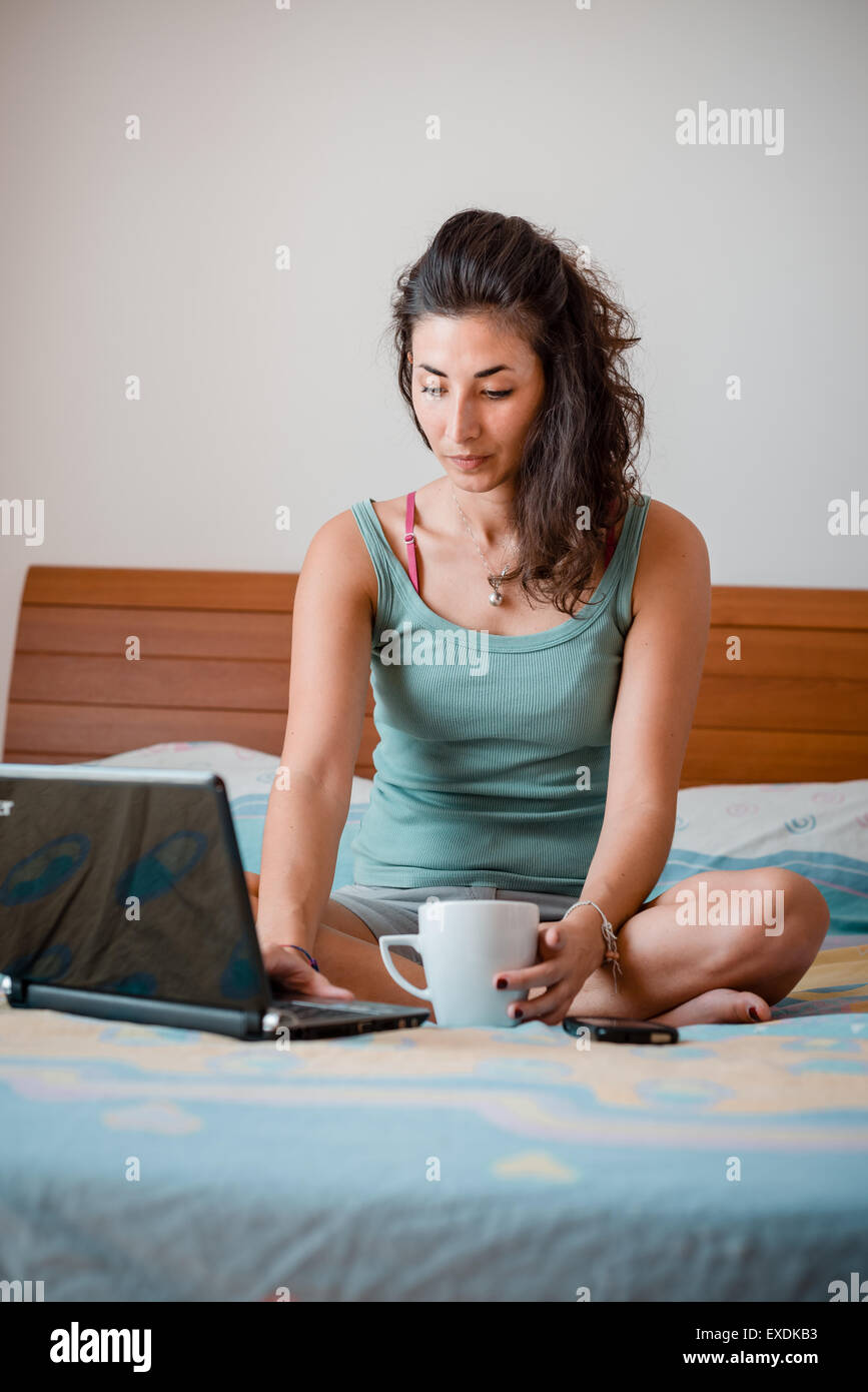 beautiful woman using notebook at home Stock Photo - Alamy