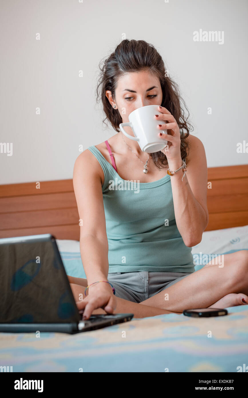 beautiful woman using notebook at home Stock Photo - Alamy