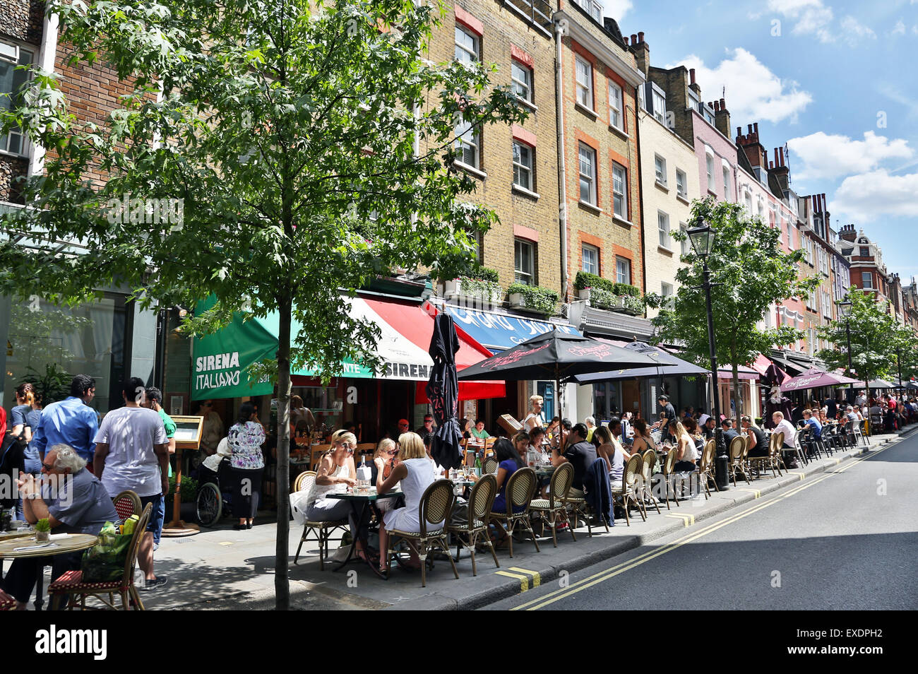 Lunchtime diners al fresco on summer's day in James Street, London Stock Photo