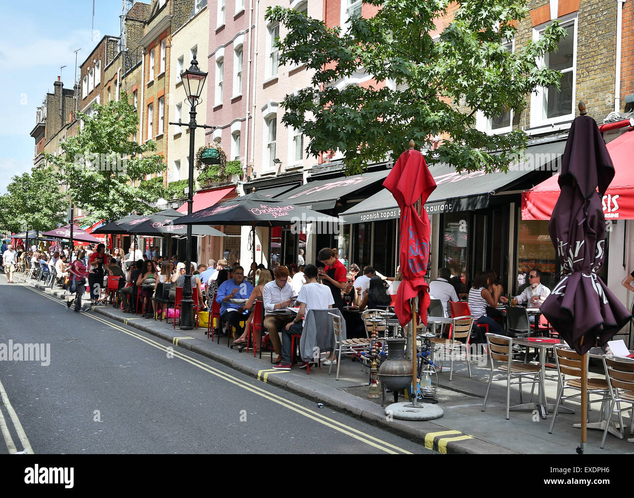 Lunchtime diners al fresco on summer's day in James Street, London Stock Photo