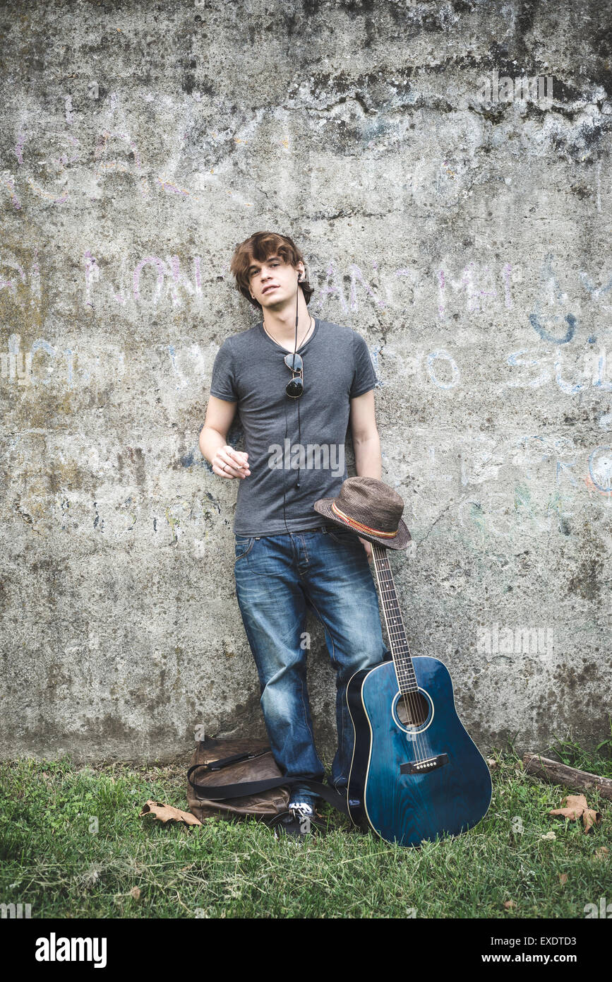young stylish blonde hipster man in the park Stock Photo - Alamy