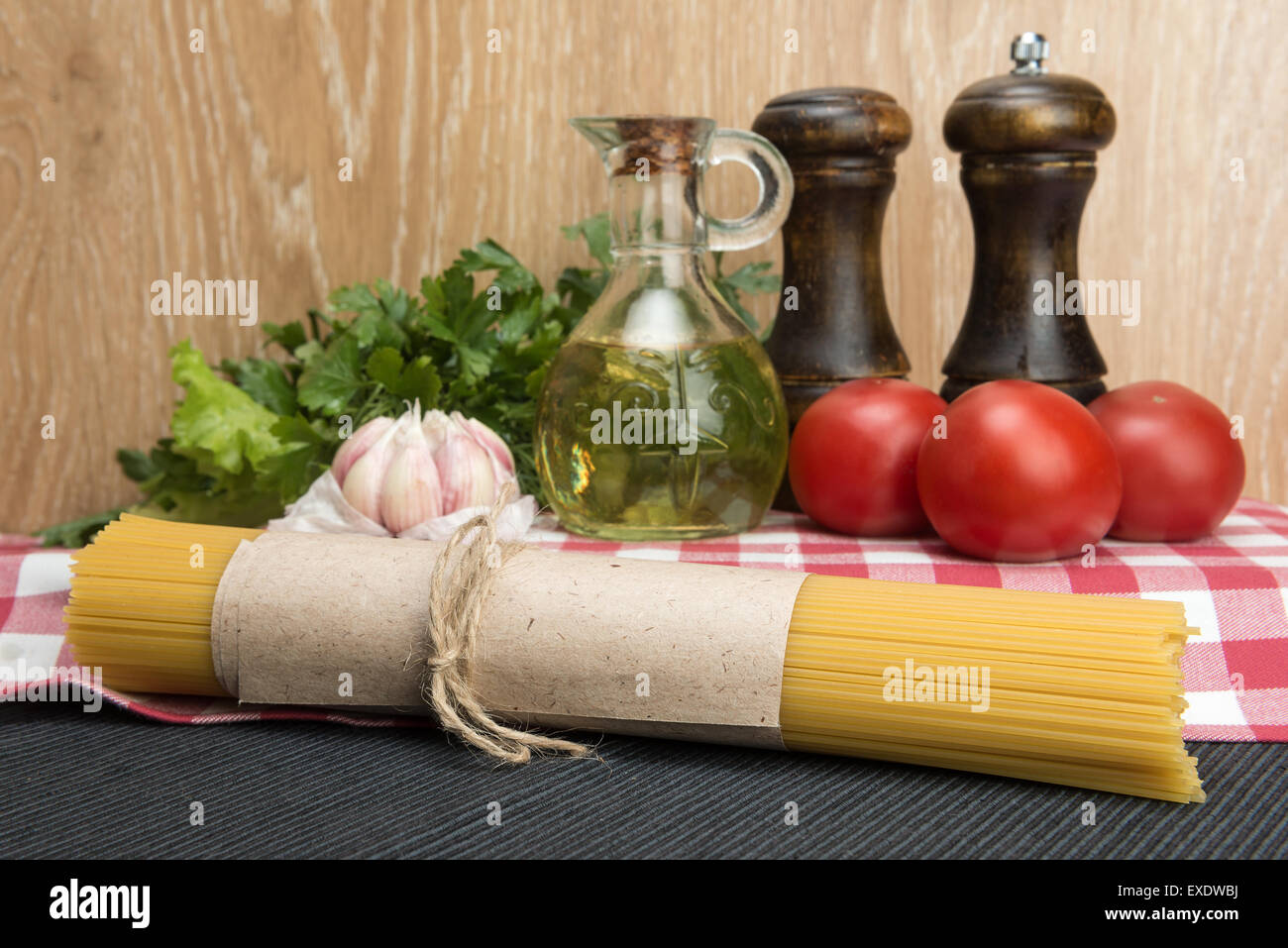 Spaghetti in packaging and ingredients for condiment Stock Photo