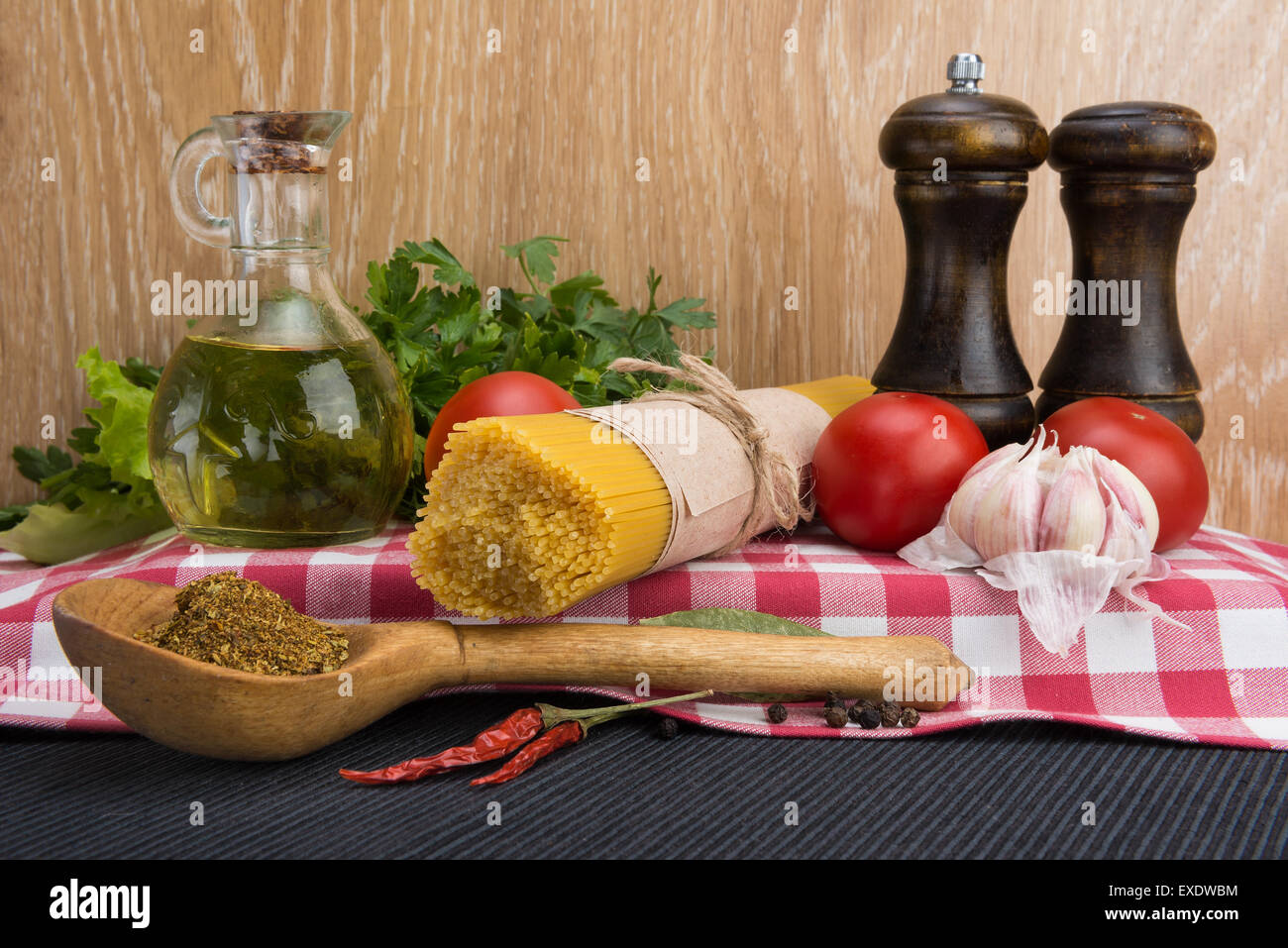 Spaghetti in packaging and ingredients for condiment Stock Photo