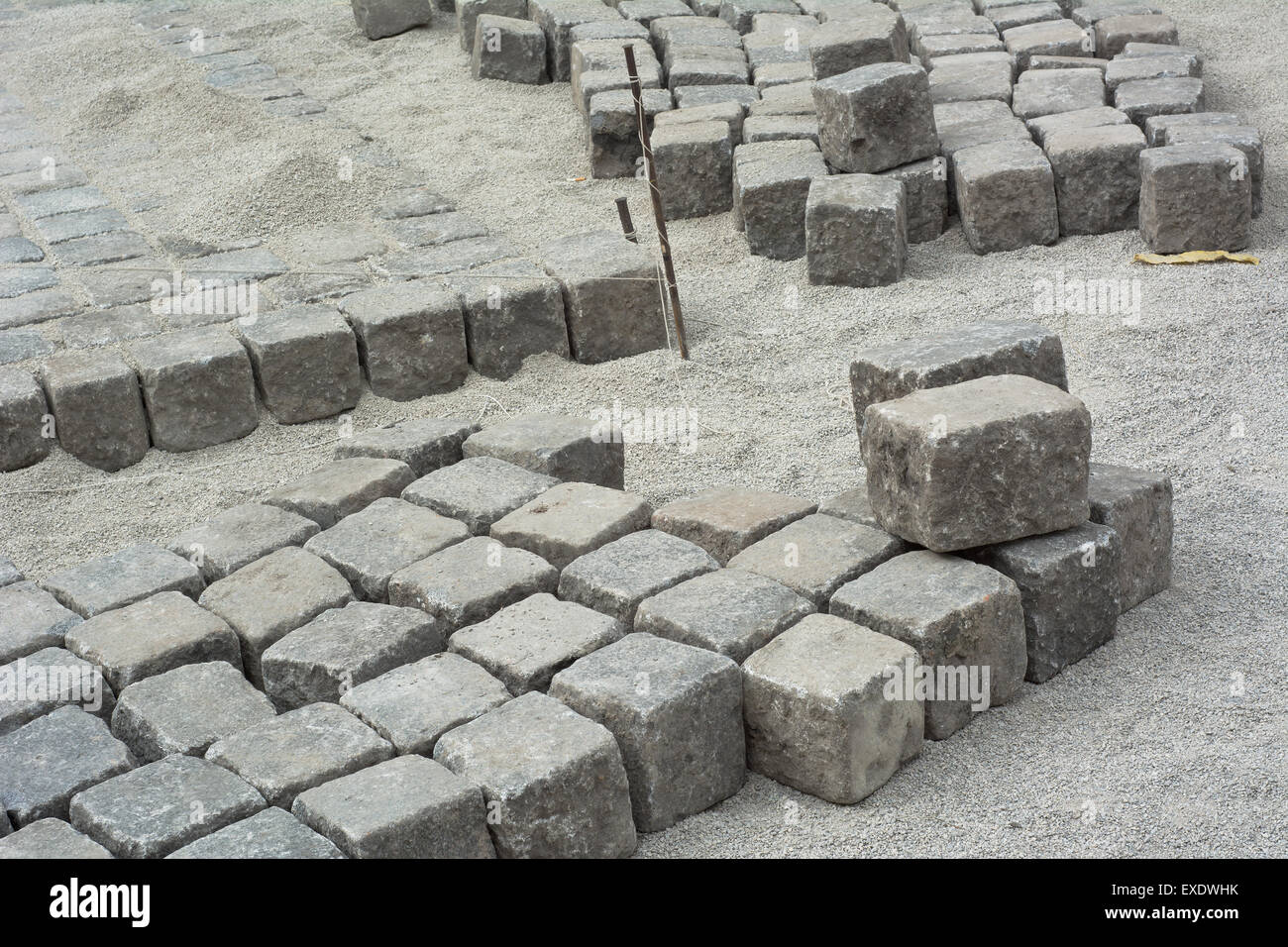 Road Construction Site with Cobblestone and Gravel Stock Photo