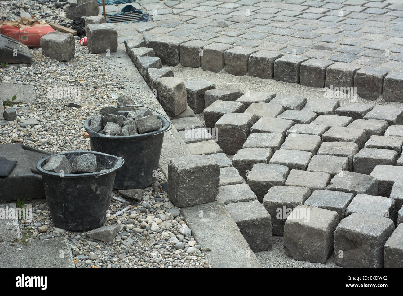 Road Construction Site with Cobblestone and Gravel Stock Photo