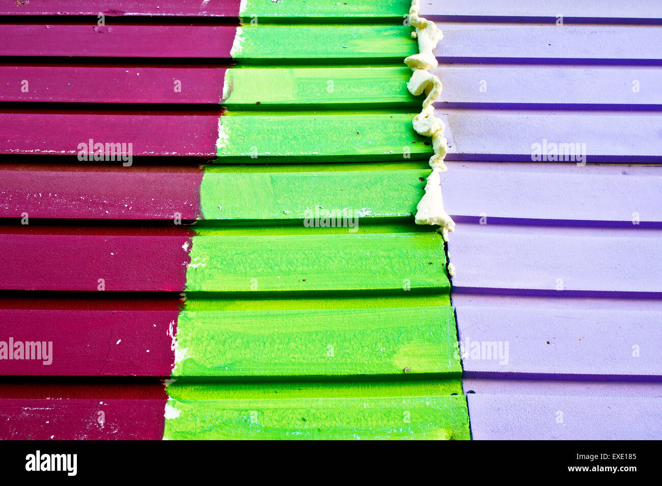 Purple,green,and red wood panels with adhesive resin Stock Photo