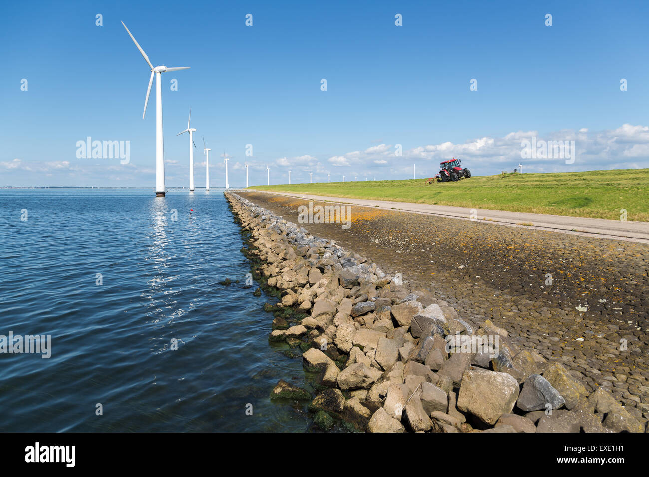 Long row off shore wind turbines along the Dutch coast with a tractor ...