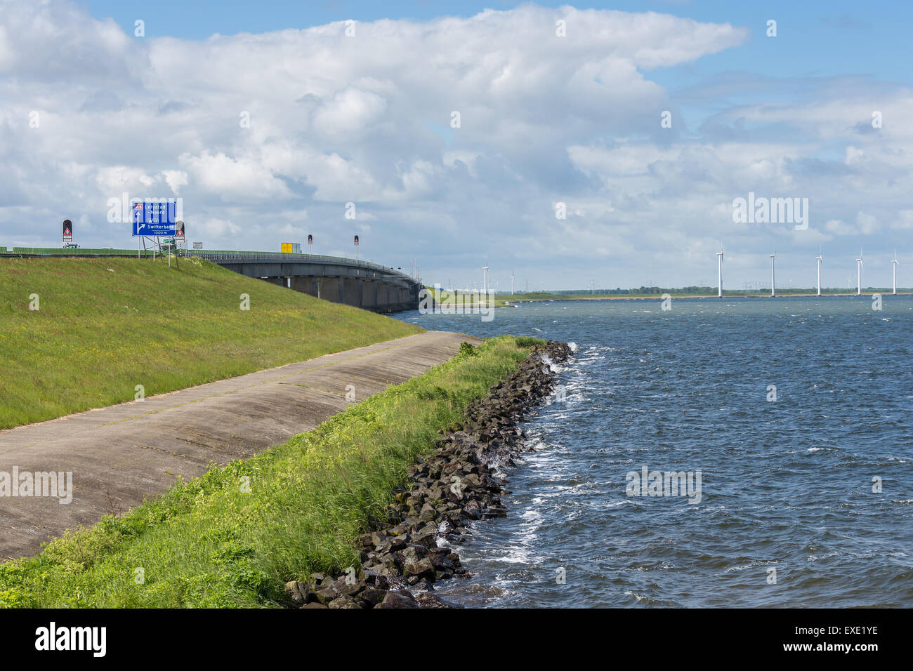 Dike with big concrete bridge of Dutch highway Stock Photo Alamy