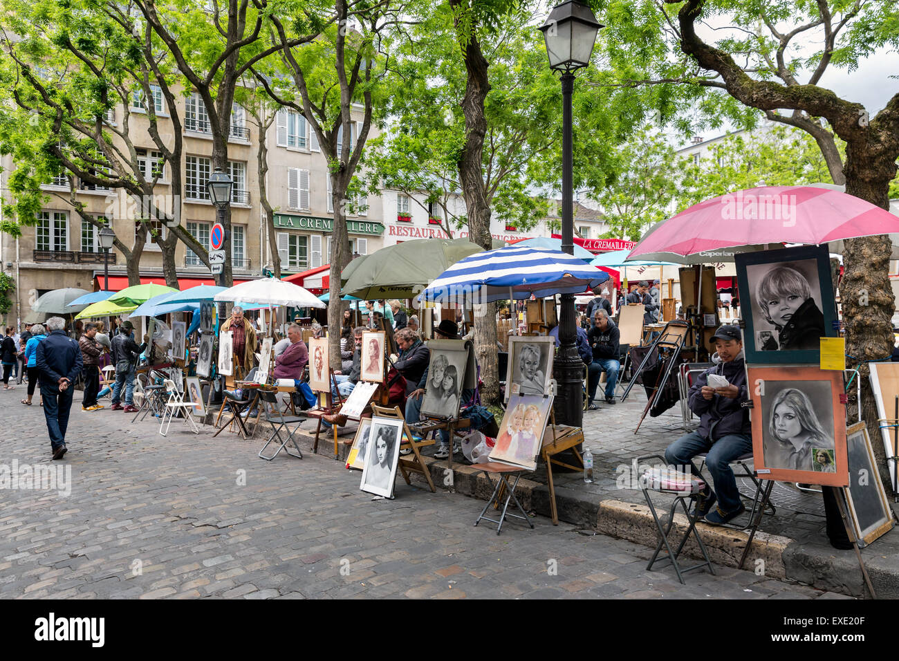 Place du Tertre in Montmartre with street artists ready to paint tourists in Paris, France Stock Photo