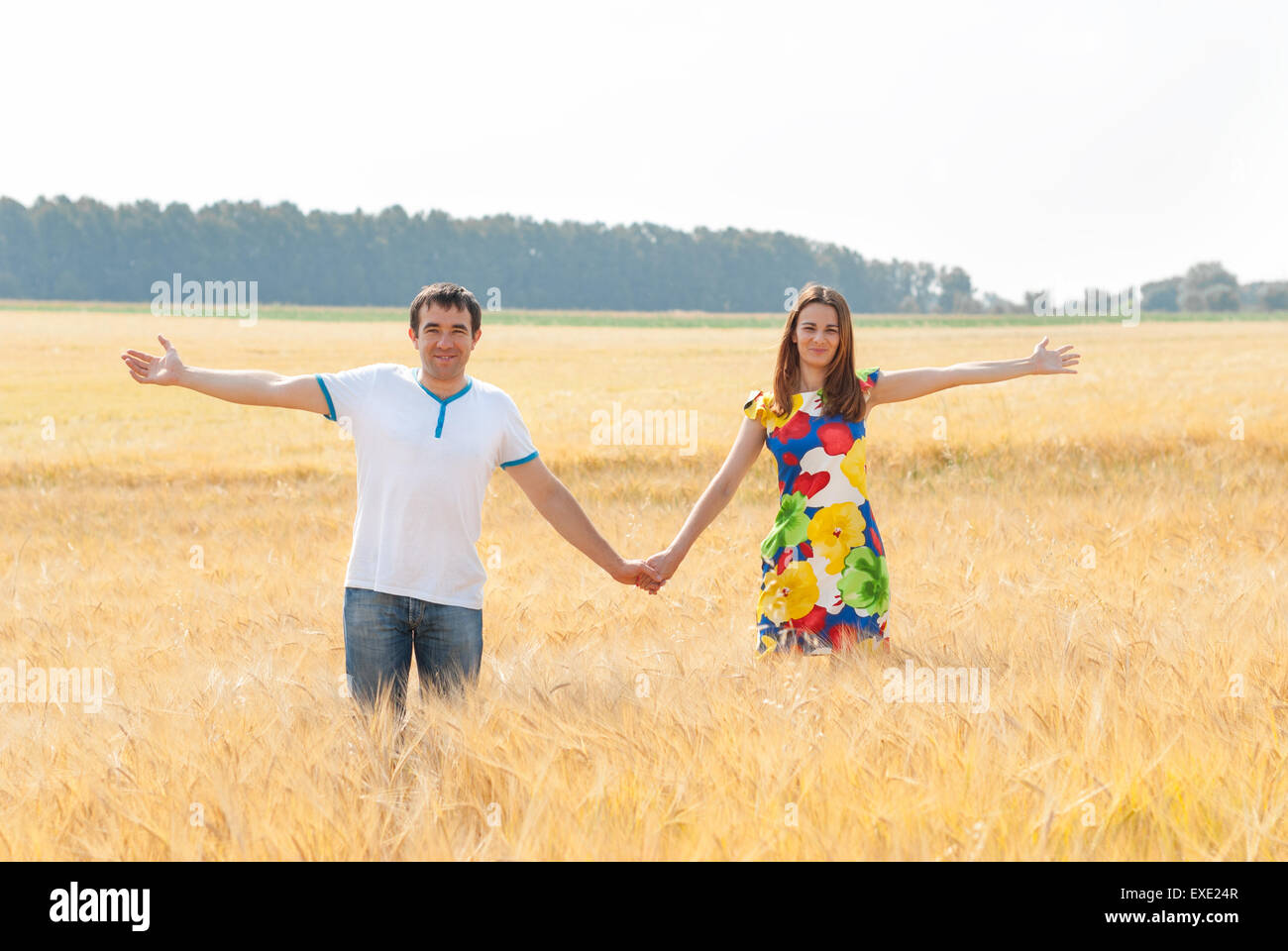 Happy couple in love in the field. Stock Photo