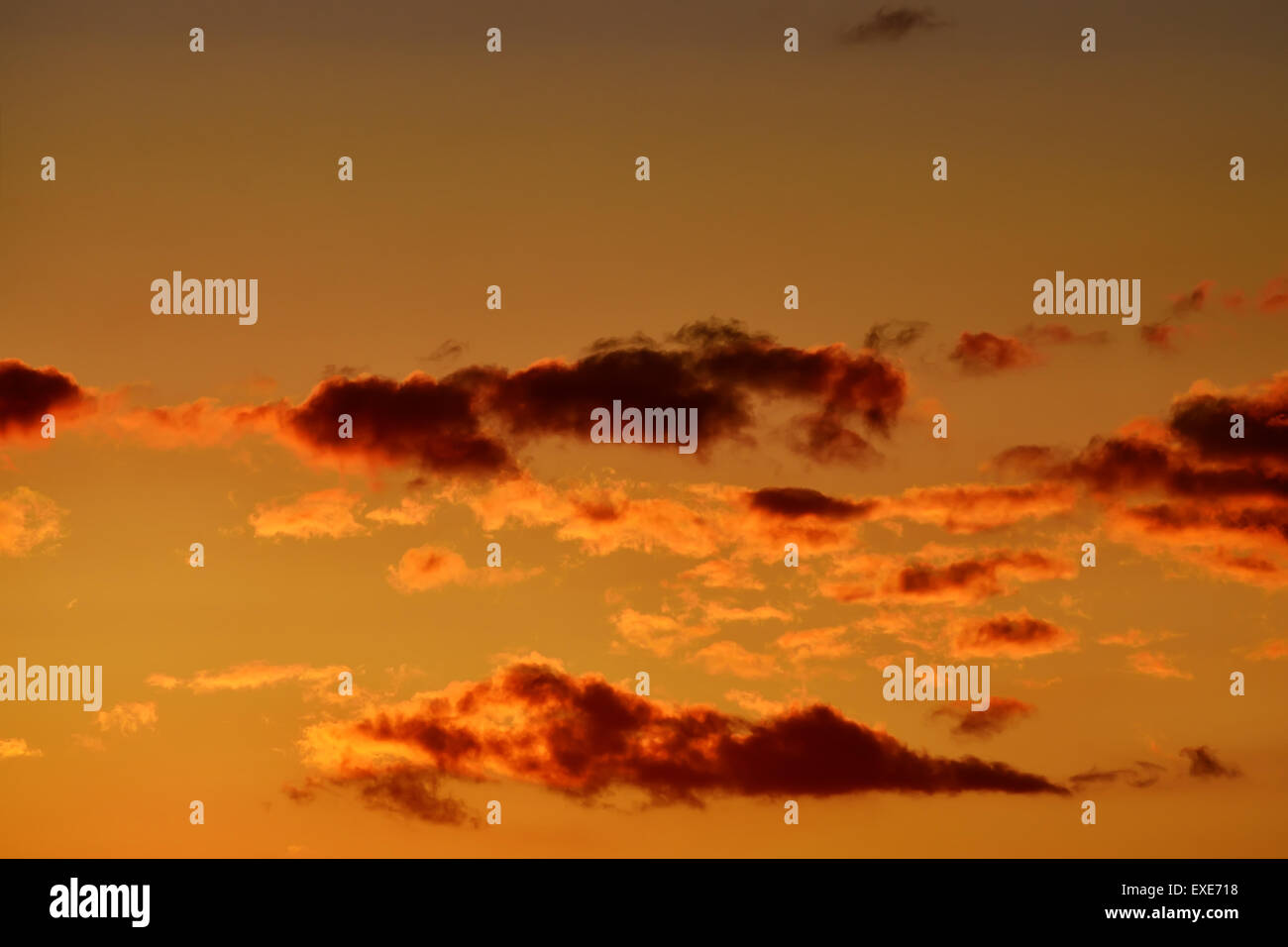 Heavenly landscape with dramatic crimson sunset clouds Stock Photo - Alamy