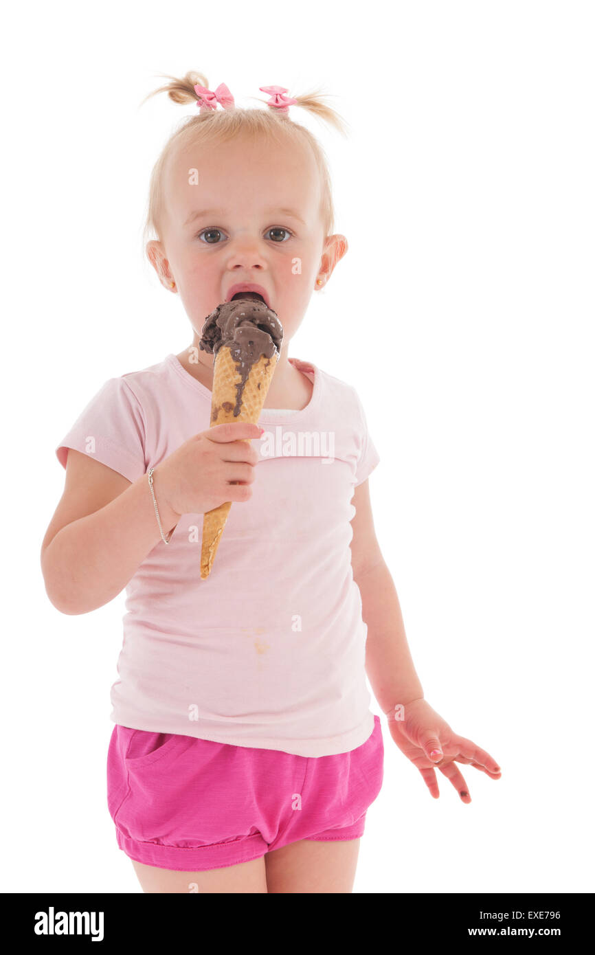 Portrait toddler girl eating chocolate ice cream isolated over white background Stock Photo Alamy