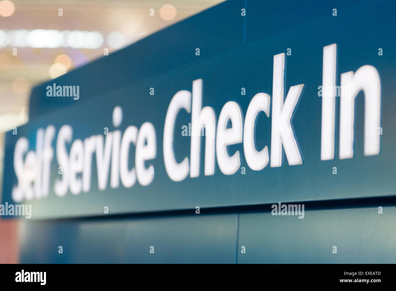 self service check in sign at airport Stock Photo