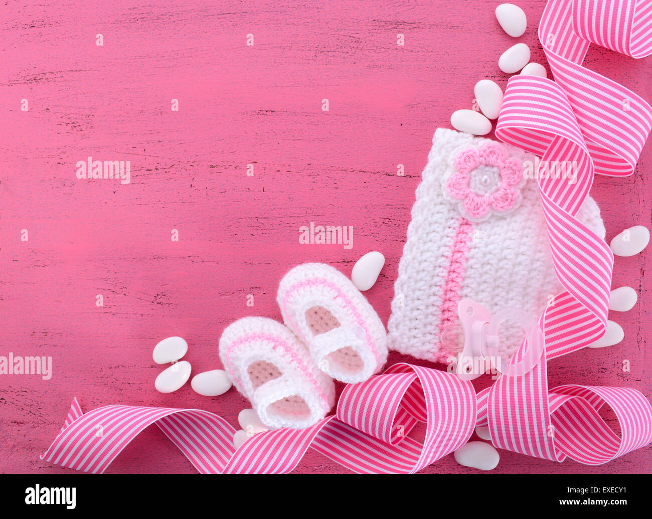 Its a Girl Baby Shower or Nursery background with baby clothes and accessories with copy space for your text here. Stock Photo