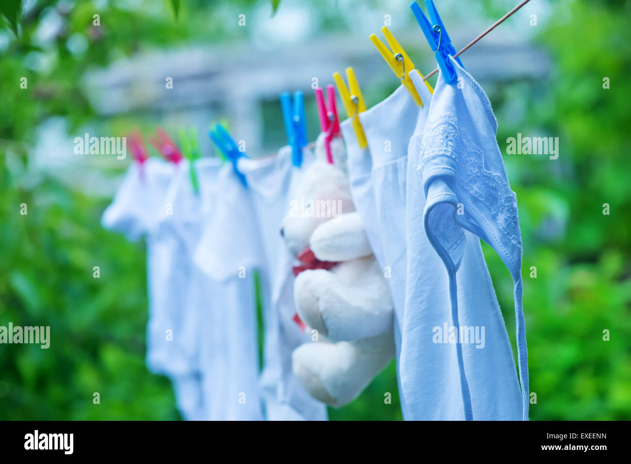 baby Clothes hanging on line in garden Stock Photo Alamy