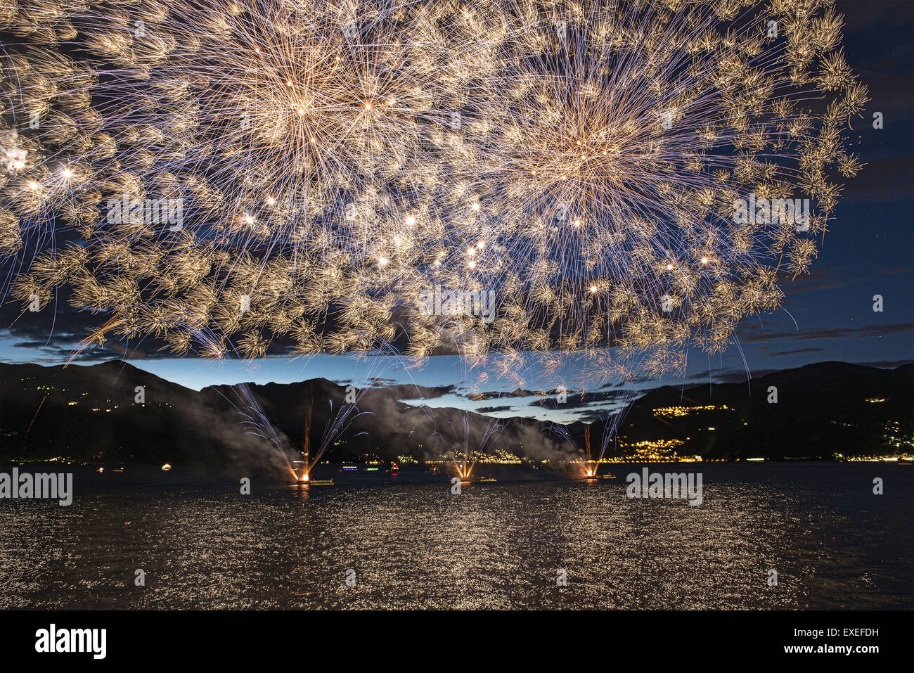 Lakefront Luino, fireworks on the Maggiore lake, Lombardy - Italy Stock Photo