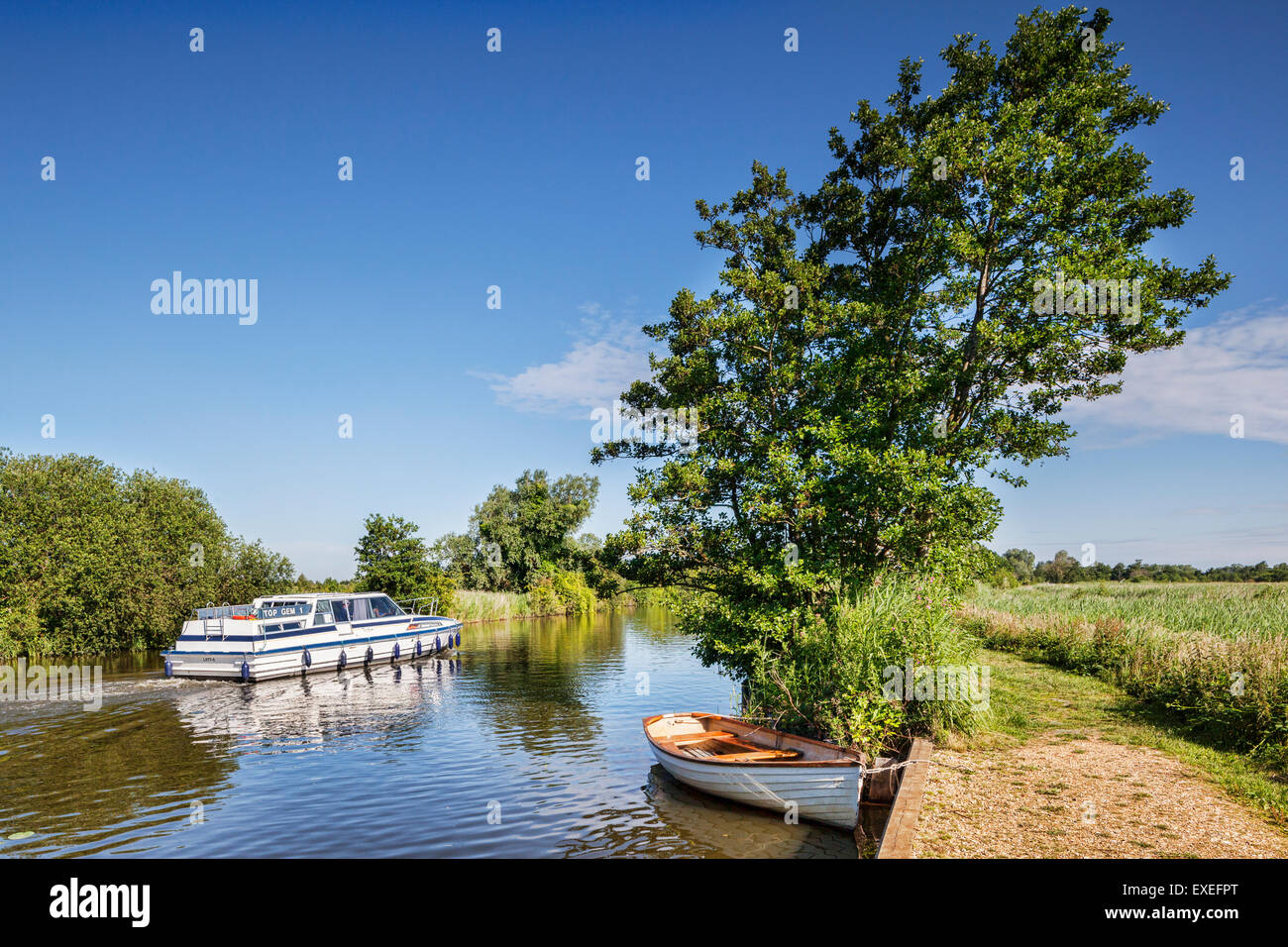 Motor cruiser on the Norfolk Broads near How Hill, Norfolk, England Stock Photo