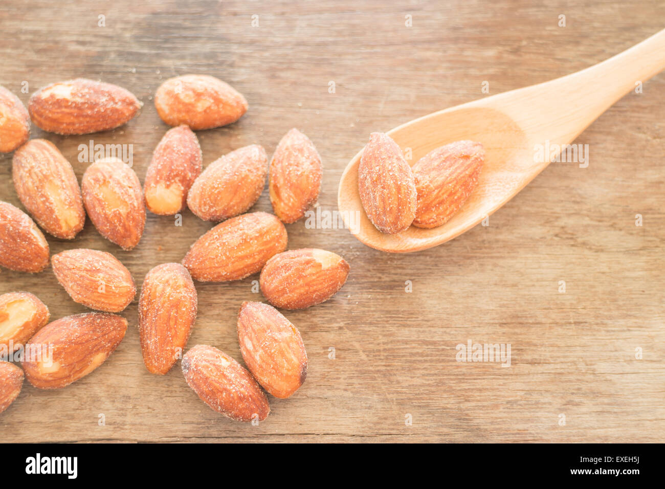 Almond grain roast salt on weathered wooden table, stock photo Stock Photo